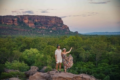 Couple standing on a rock surface at Nawurlandja lookout